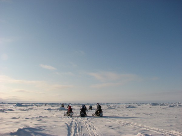 A group travelling by snowmobile over sea ice on the Chukchi Sea, off Point Barrow, Alaska. ©Dan Slavik/WWF-Canada