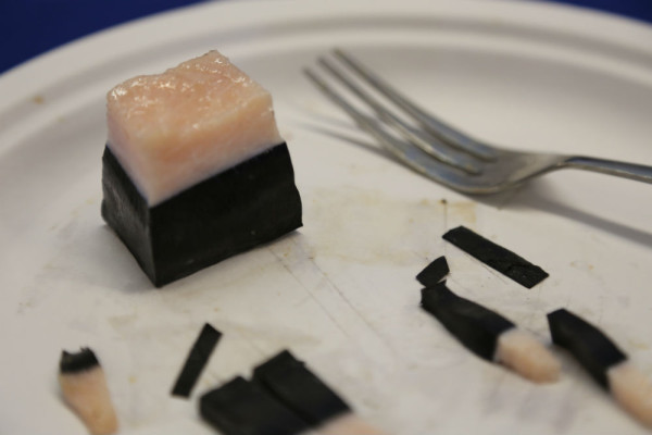 A sliver of maqtaq from a bowhead whale- a part of the traditional diet for many Inuit. ©Dan Slavik/ WWF-Canada