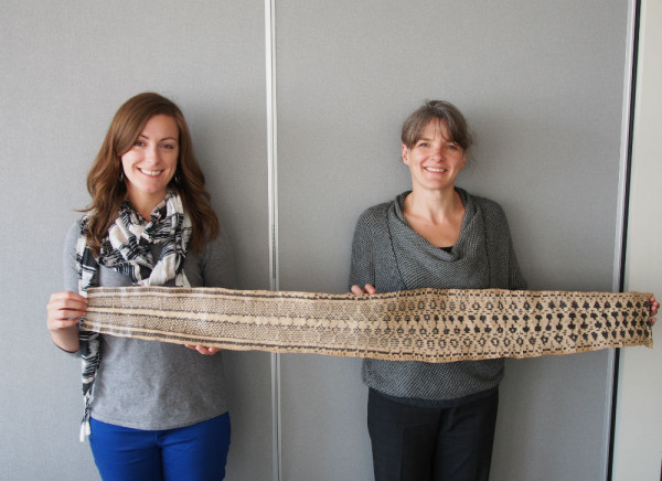Two WWF-Canada staffers show the size of the snakeskin. 