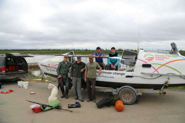 Nanuq, Dan, and the crew stand in front of "The Arctic Joule", ready to cast off for the Northwest Passage.