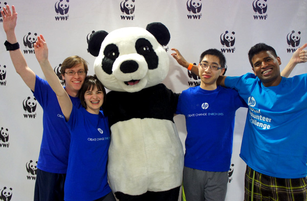 A group of HP Canada employees pose with Panda before climbing the CN Tower