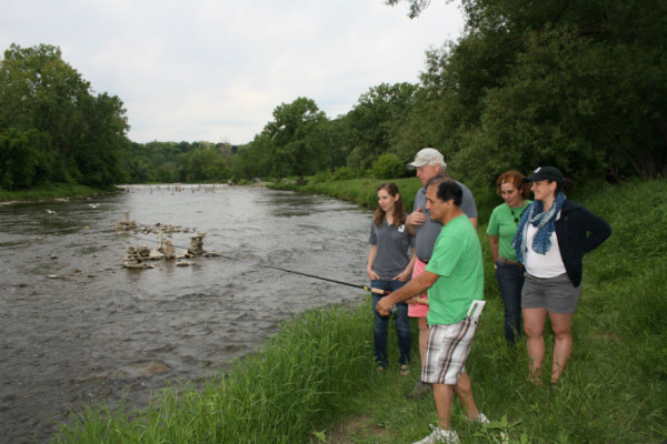 Representatives from Futurewatch give David Miller and members of WWF’s Freshwater team a fishing demonstration on the Humber River © Riannon John/WWF-Canada