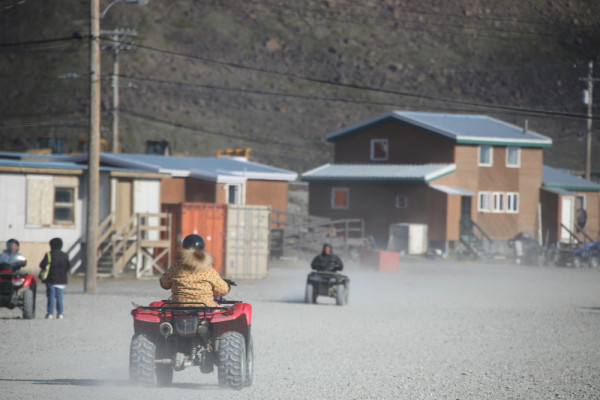 Ulukhaktokmiut commute around town on ATVs, usually wearing colourful parkas in spite of the sunny weather. ©Dan Slavik/WWF-Canada  