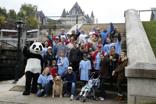 The Panda, Ottawa Redblacks’ Big Joe and volunteers at Parliament Hill in Ottawa.