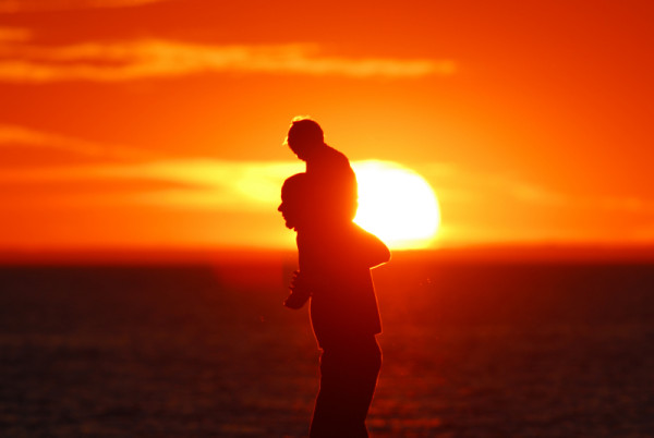 A father and his child enjoying the sunset over Lake Ontario, Ontario, Canada. © Frank PARHIZGAR / WWF-Canada