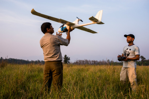 An unmanned aerial vehicle is readied for a test flight in Nepal’s Bardia National Park. © The Ginkgo Agency, Gary Van Wyk