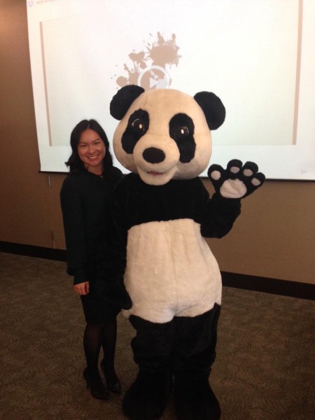 Green Champion Stephanie Nakamura with panda and Lindt’s Town Hall. © Lindt & Sprüngli Canada Inc. 