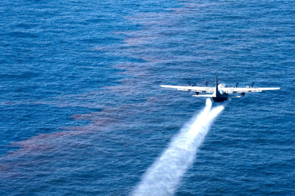 A C-130 Hercules from the Air Force Reserve Command's 910th Airlift Wing at Youngstown-Warren Air Reserve Station, Ohio, drops an oil-dispersing chemical into the Gulf of Mexico May 5, 2010, as part of the Deepwater Horizon Response effort. The 910th AW specializes in aerial spray and is the Department of Defense's only large-area, fixed-wing aerial spray unit. © US Air Force public affairs