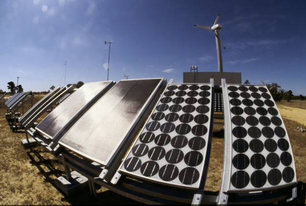 Solar panels and wind turbines at a renewable energy research station in Perth, Western Australia.