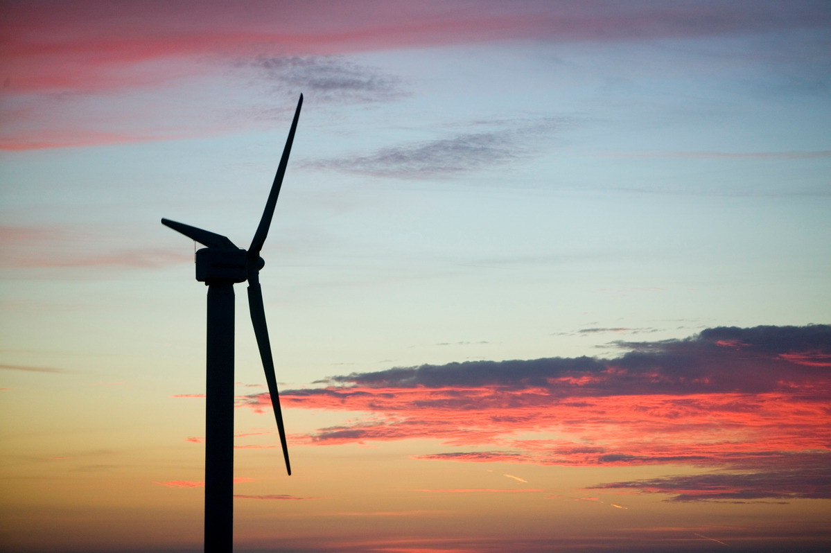 Wind turbine at sunset. © Global Warming Images / WWF