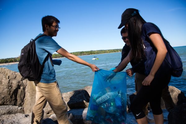 Students pickup litter at Woodbine Beach in Toronto, Ont. as part of the Great Canadian Shoreline Cleanup.