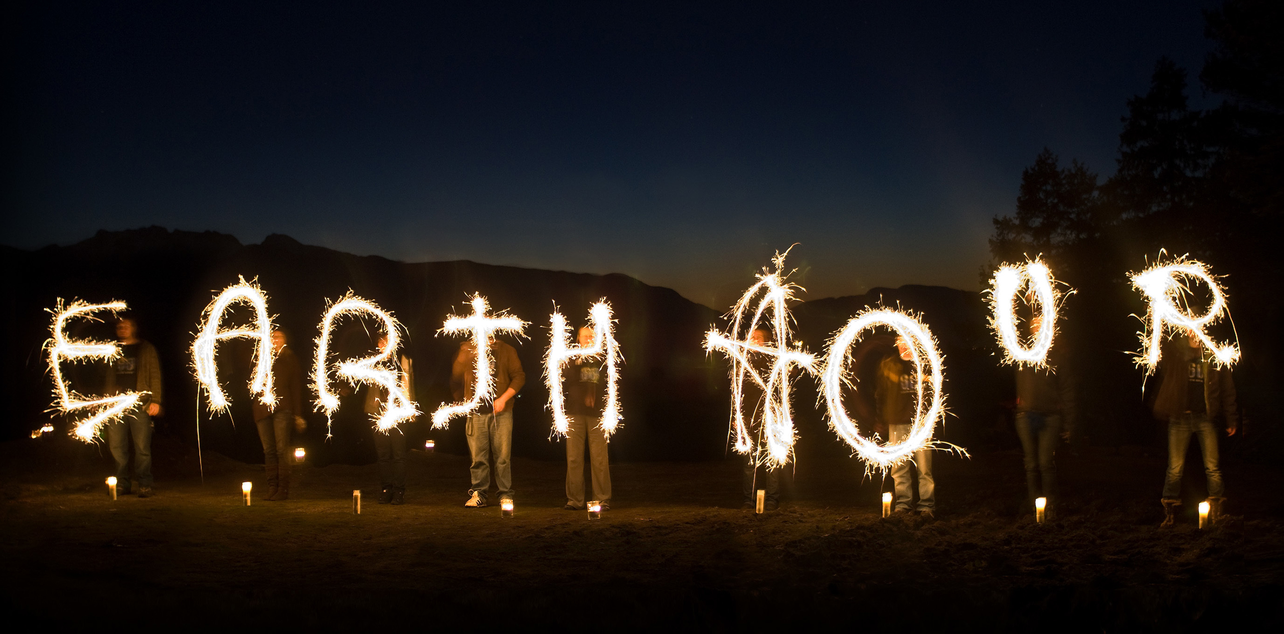 A-group-spells-out-Earth-Hour-with-sparklers-against-the-dark-sky.