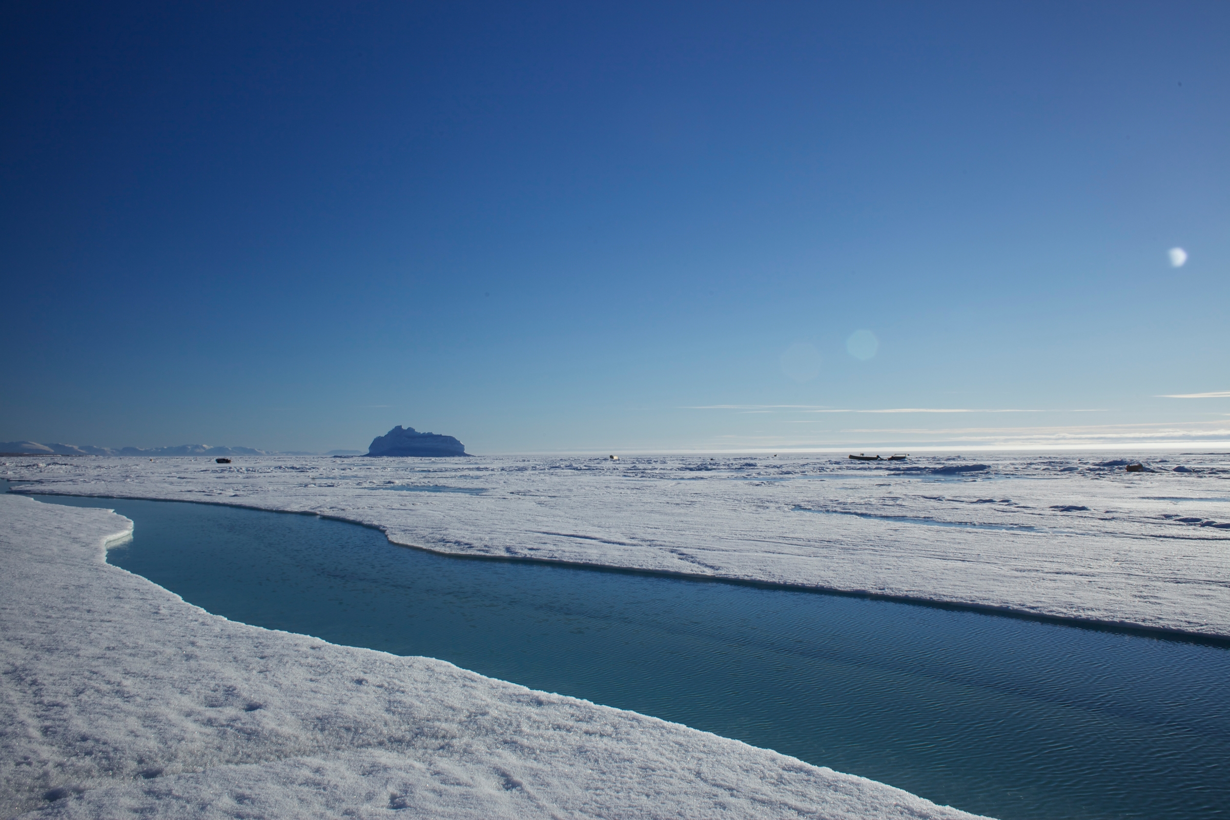 Large pieces of broken sea ice shape a sea water stream. Sea ice floe edge, Pond Inlet, Nunavut, Canada (part of the Last Ice Area).