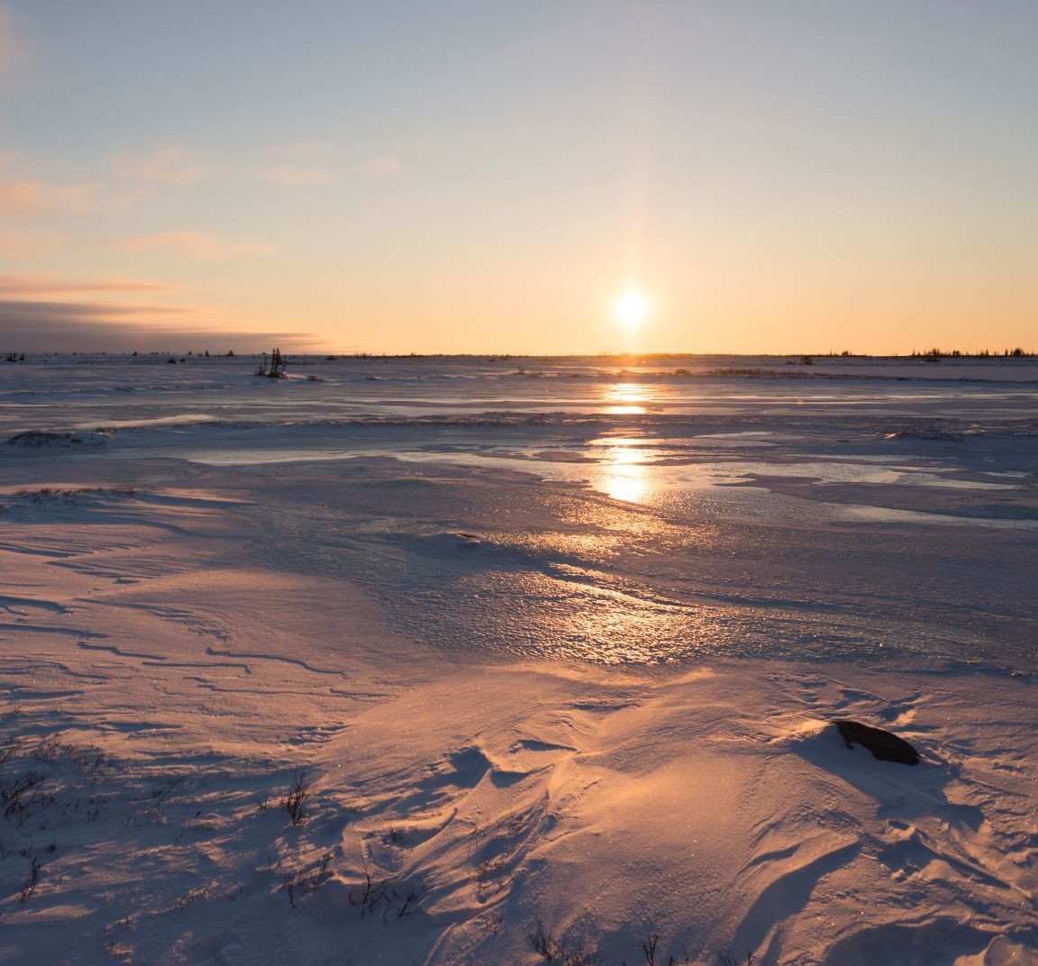 Sunrise over icy landscape in Churchill