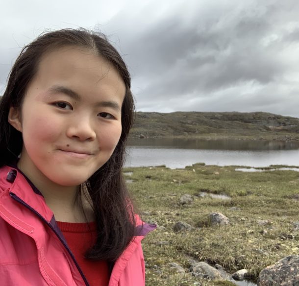 photo of Katie Yu, WWF-Canada intern, beside a lake near Iqaluit, Nunavut