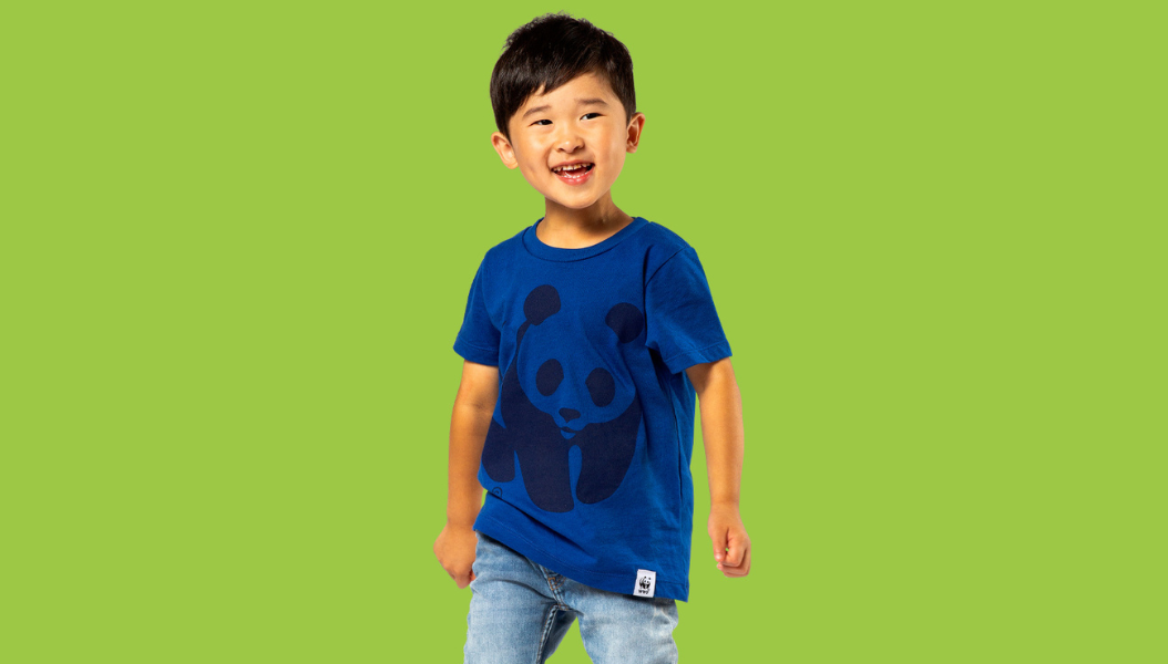 Young boy wearing a dark bluee WWF T-short