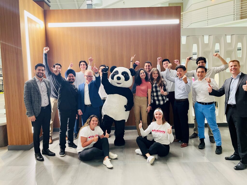 Nissan Canada team members pose with WWF's panda mascot