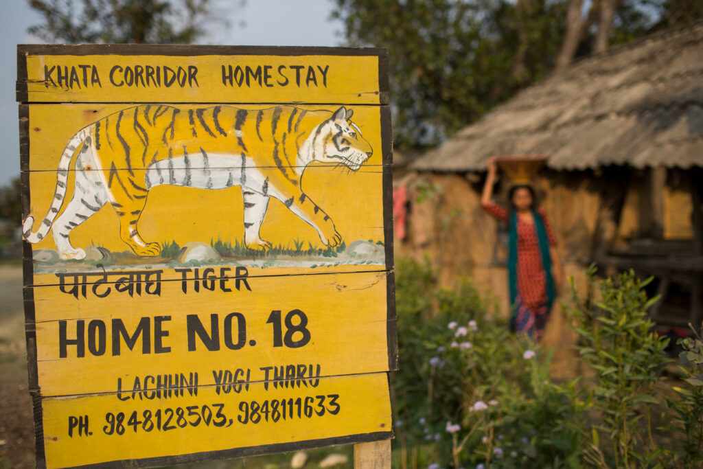 Homestay near tiger habitat, Nepal with a sign warning of tigers.