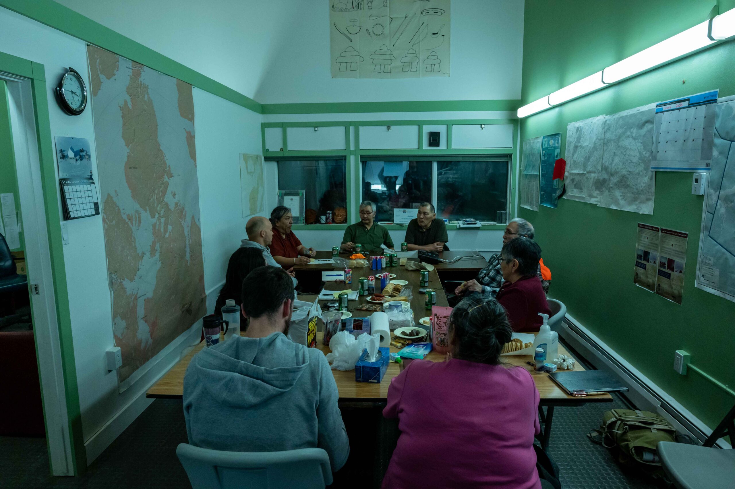 A group of people in a meeting room 