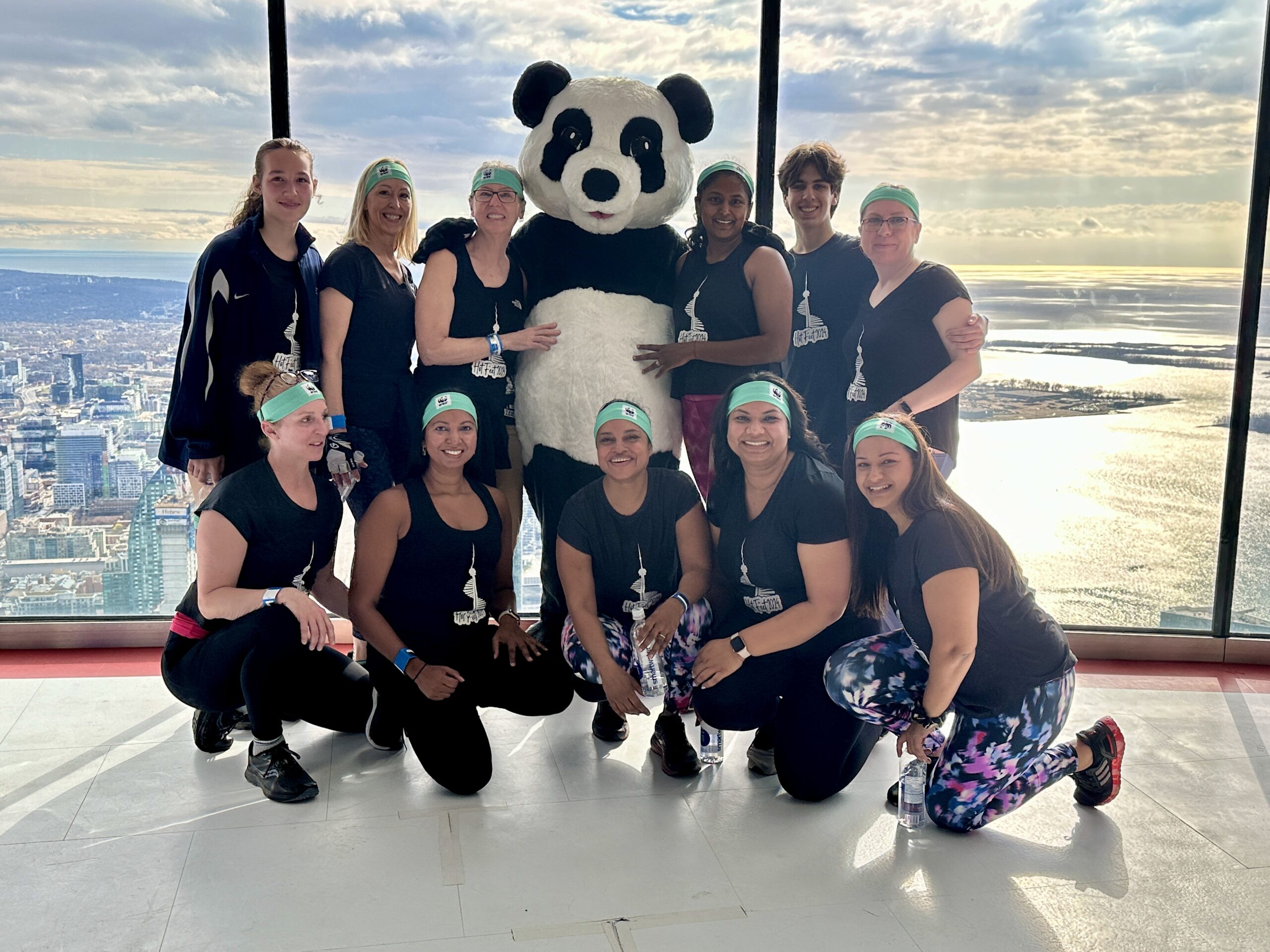 Climbers with Panda at the observation decks o the CN Tower 