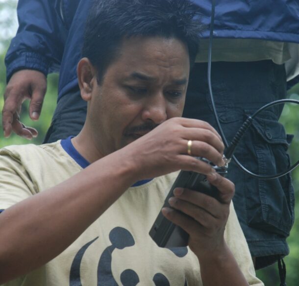 Dr. Rinjan Shrestha Testing satellite collars during a tiger telemetry operation in Nepal