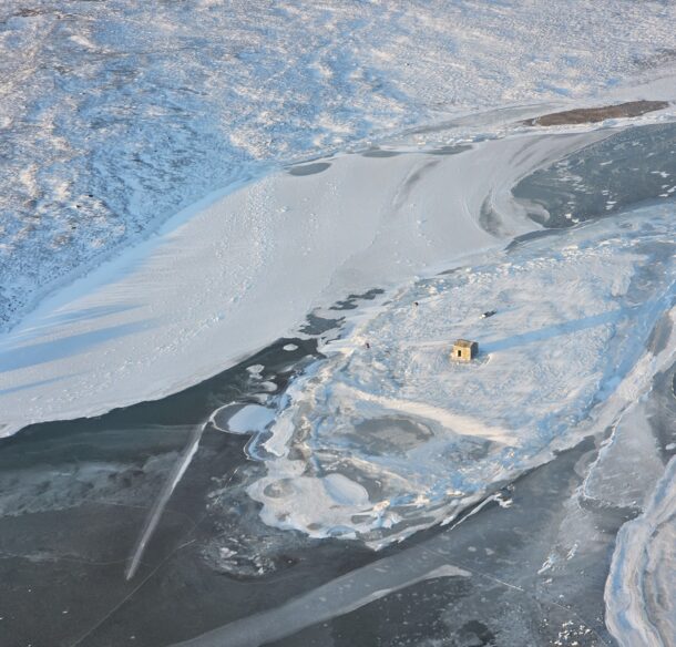 Small cabin on a frozen lake