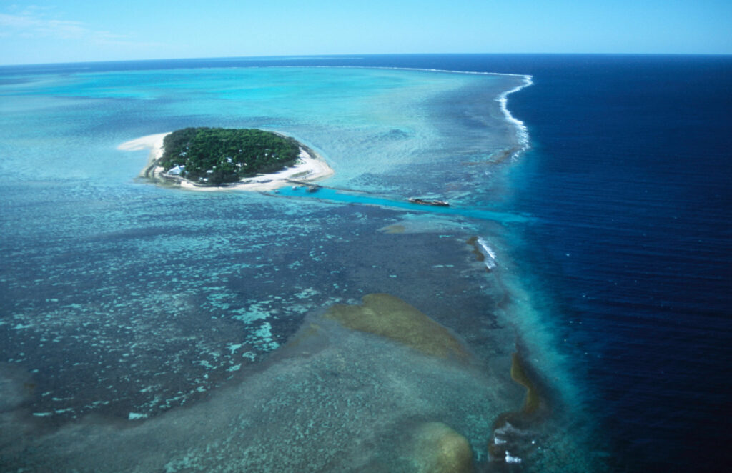 Tropical island surrounded by turquoise waters