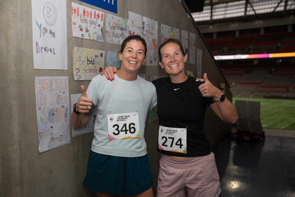 Olympic soccer champion Stephanie Labbé and member of Glutes Gone Wild climb team after finishing their climb for nature (c) WWF-Canada/Beau Chevalier